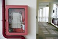 Fire extinguisher and fire hose reel in hotel corridor. Fire hoses rack for use. Royalty Free Stock Photo