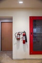 Fire extinguisher and gas pump system on the wall. Powerful emergency fire extinguisher equipment. Fire retardant. Fireproof. Royalty Free Stock Photo