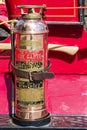 Fire extinguisher isolated on a vintage firetruck