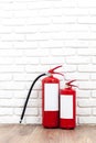 Fire extinguisher near white wall Royalty Free Stock Photo