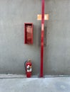 Fire extinguisher set industrial concrete wall Royalty Free Stock Photo
