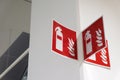 Fire extinguisher sign on the white wall. Royalty Free Stock Photo