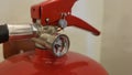 Fire extinguisher under preasure in daylight. Royalty Free Stock Photo