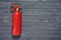 Fire extinguisher on wooden planks Royalty Free Stock Photo