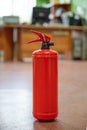 Fire extinguisher in workplace office. The concept of fire safety Royalty Free Stock Photo