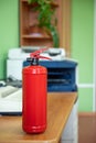 Fire extinguisher in workplace office. Fire safety Royalty Free Stock Photo