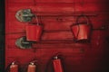 Fire extinguishing tools. Shovels, buckets, fire extinguishers on a red wooden wall Royalty Free Stock Photo