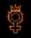 Fire female gender sign with queen crown burning in flames, isolated on black background with bright sparkles. Sex rights, girl Royalty Free Stock Photo