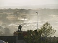 Fire fighter in action on truck roof