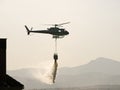 Fire fighter helicopter dropping water in Colmenar Viejo Spain Royalty Free Stock Photo