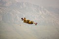 Fire fighter plane over the mountains Royalty Free Stock Photo