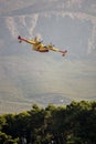 Fire fighter plane over the mountains Royalty Free Stock Photo