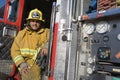 Fire Fighter Sitting At Fire Brigade's Door Royalty Free Stock Photo