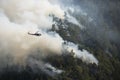 Fire fighters in helicopter observing the Loge Fire, California