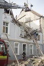 Fire fighters try to put out the first man found and rescued