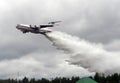 Fire-fighting aircraft IL-76TD drops water over the range of the Noginsk rescue center EMERCOM of Russia at the International Salo Royalty Free Stock Photo