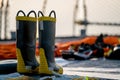 Fire fighting boots dry on the navy ship deck after used and cleaned