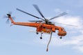 Fire Fighting Erickson Air Crane S-64 helicopter N243AC taking off after filling with a load of water from a small lake before dro Royalty Free Stock Photo