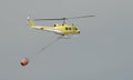 Fire fighting helicopter flying through a smokey sky Royalty Free Stock Photo