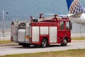 Fire fighting with water spray. Fire truck and fire engine with fire men. Emergency and conflagration. Fire disaster and crisis Royalty Free Stock Photo