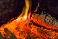 Fire fireplace Embers closeup. Glowing embers in hot red color.