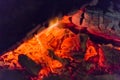 Fire fireplace Embers closeup. Glowing embers in hot red color.