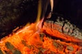 Fire fireplace Embers closeup. Glowing embers in hot red color.