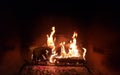 Fire in fireplace Killington Vermont Is real wood crackling burning hot coals Cabin rustic Is ski lodge