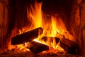 Fire in a fireplace with logs and flames creating a sense of warmth and coziness