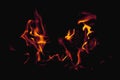 Fire flame against black background as symbol of hell and eternal pain. Horizontal image