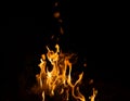 Fire flame caused by burning of wood on a black background Royalty Free Stock Photo