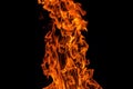 Fire flame isolated over black background, abstract texture Royalty Free Stock Photo