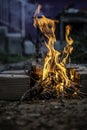 Fire flames at backyard, close-up. Preparing embers for Turkish barbecue.