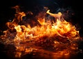 Fire flames with sparks on black background Royalty Free Stock Photo