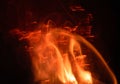 Fire flames with sparks on a black background, abstract Royalty Free Stock Photo