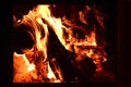 Fire or flames with sparks in fireplace close up. 4k resolution. Fire is burning in the fireplace Royalty Free Stock Photo