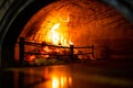 Fire and Flames in Wood Fired Pizza Oven in Pizzeria Restaurant. Firewood Pizza Oven