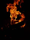 Fire Flmes coming out of a bonfire in dark Royalty Free Stock Photo