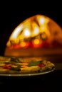 Pizza on wood burning fire oven Royalty Free Stock Photo