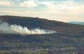 Fire in the forest near the city.