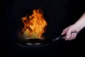Fire on frying pan Royalty Free Stock Photo