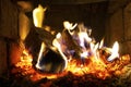 The fire in the furnace. Ember and fire close up. Coals, flames, comfort, relax concept background