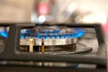 Fire on the gas stove burner. Burner gas stove, concept of energy. Closeup, selective focus Royalty Free Stock Photo