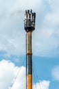 A fire on a GSM antenna on a high tower. On the background of the blue sky, a transmitter for transmitting a 5g signal. danger to Royalty Free Stock Photo