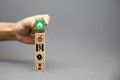 Hand choose cube wooden toy block stack with prevent icon with fire extinguisher and door exit and emergency bell symbol for