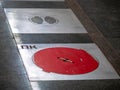 Fire hatches at the Moscow metro station. Red covers on the floor of the platform at the wells with fire hydrants in the subway