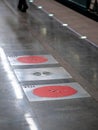 Fire hatches at the Moscow metro station. Red covers on the floor of the platform at the wells with fire hydrants in the subway