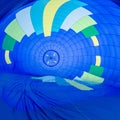 Fire heats the air inside a hot air balloon at balloon festival