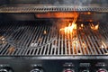 The fire heats up the grate on a gas grill for grilling meat Royalty Free Stock Photo