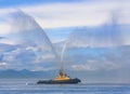 Fire hose boat spraying wate Royalty Free Stock Photo